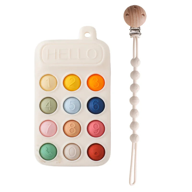 gant-de-dentition-silicone-bebe-telecommande-blanche-attache