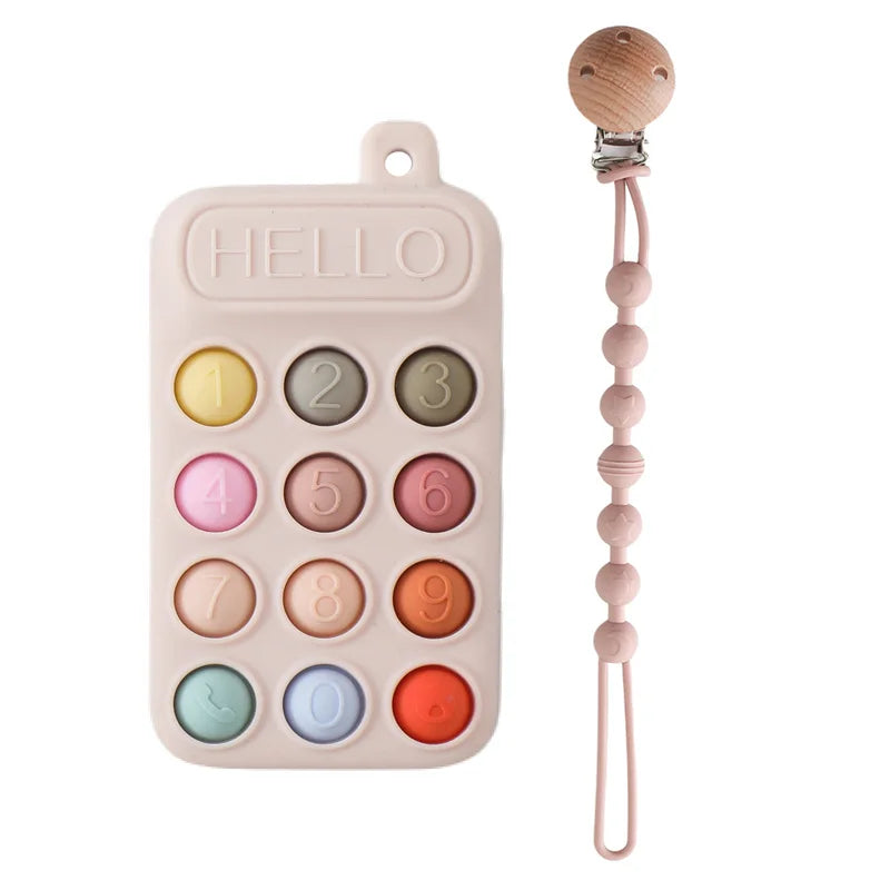 gant-de-dentition-silicone-bebe-telecommande-rose-attache